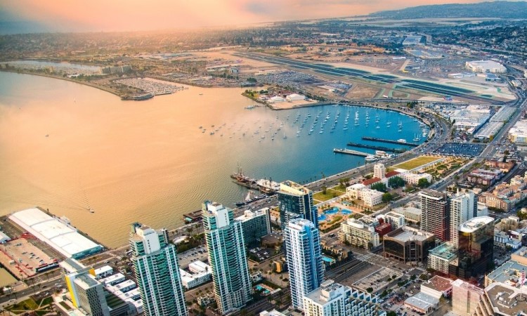 aerial view of downtown San Diego and the san diego airport, Ways to save money in San Diego